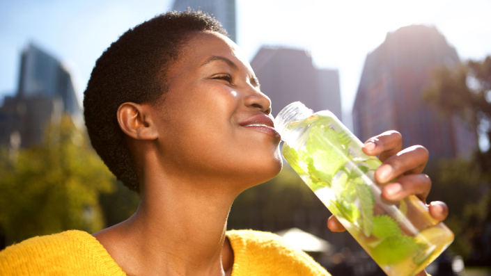 woman drinking in the sun