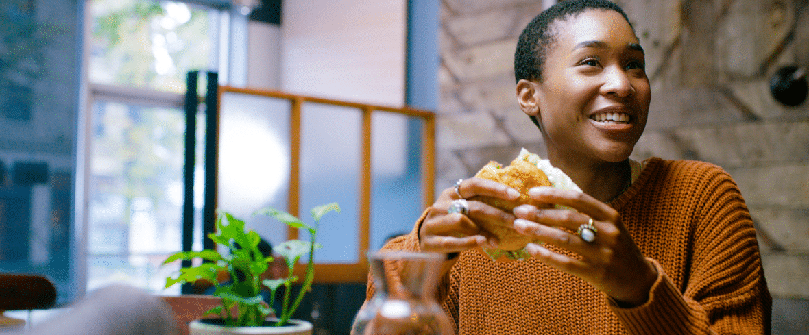 woman eating hamburger