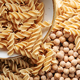 A closeup of a bowl pasta and chickpeas