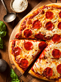 Pepperoni pizza with a slice cut