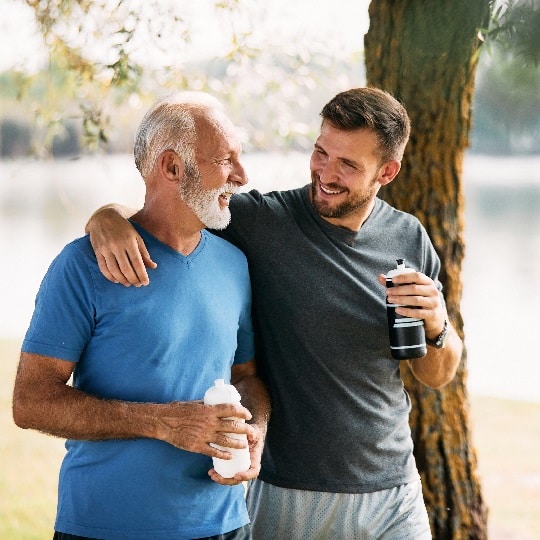 Father and son walk together and laugh