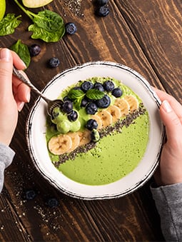 Matcha Yogurt-like dish with fruit and chia seeds