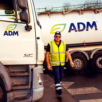 C37 Male ADM employee working near tanker truck